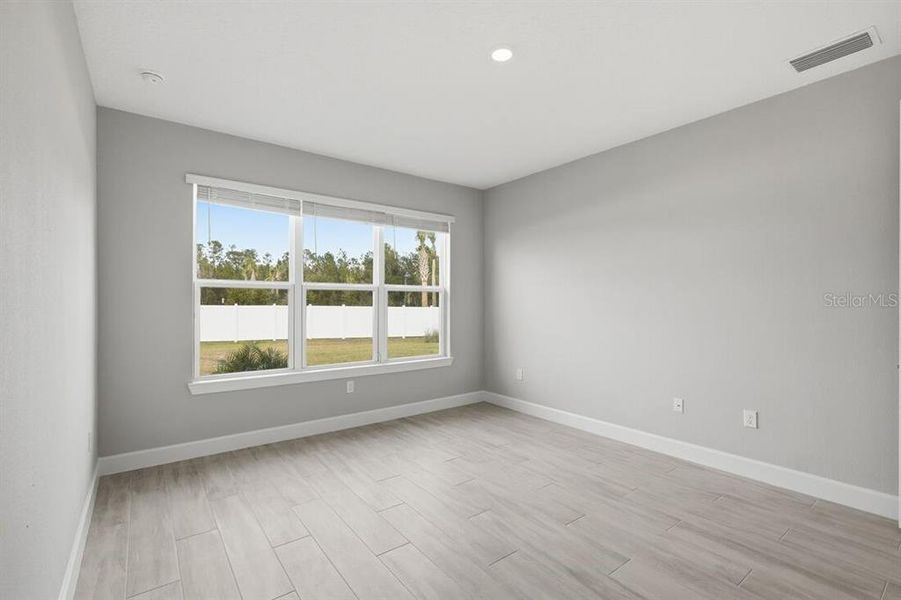 Spacious, unfurnished interior of a new home in Esplanade at Westview, Kissimmee (Image 24).