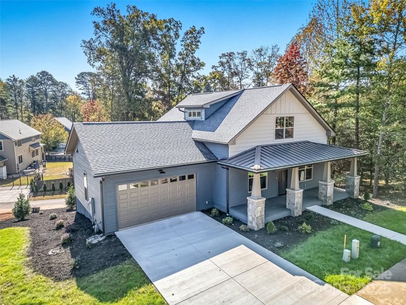 Front exterior of a new home in , Brevard, NC, highlighting curb appeal (Image 1).