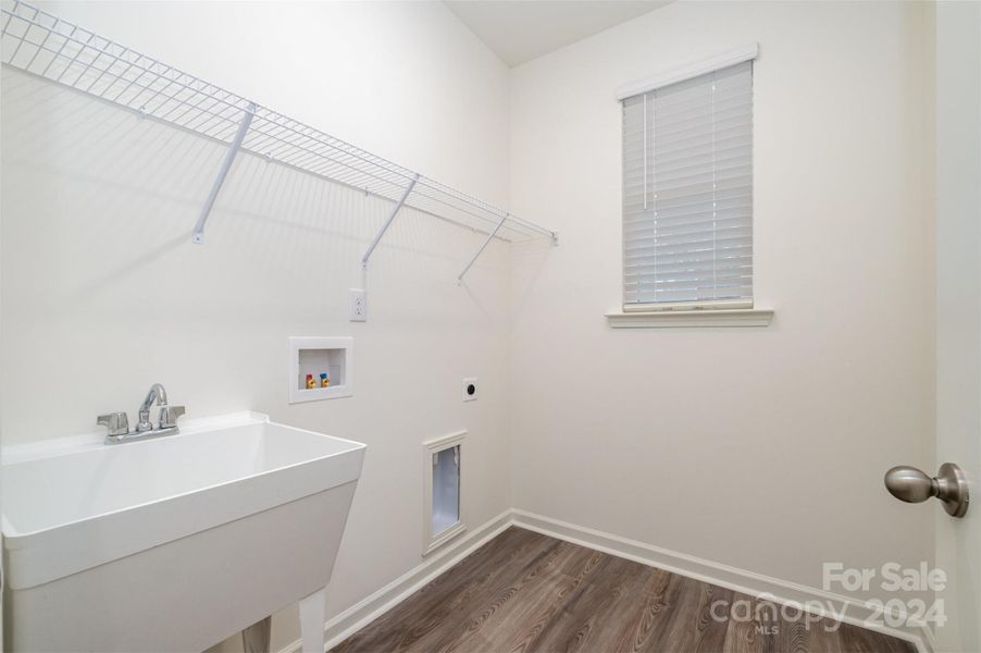 laundry room with utility sink