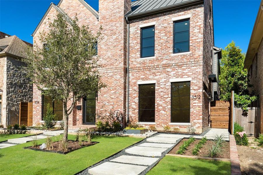 View of front of property with a front lawn