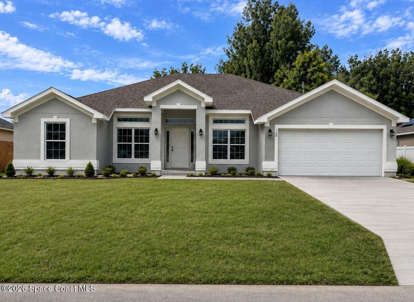 Front exterior of a new home in Palm Bay, Palm Bay, FL, highlighting curb appeal (Image 1). Front exterior of a new home in Palm Bay, Palm Bay, FL, highlighting curb appeal (Image 1).