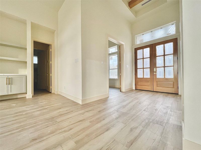 Double Front Doors with Transom window allow increased Natural Light.