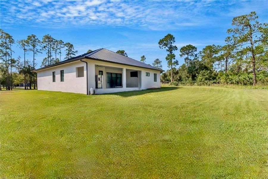 Exterior details and patio area of a home in , Naples (Image 2). Exterior details and patio area of a home in , Naples (Image 2).