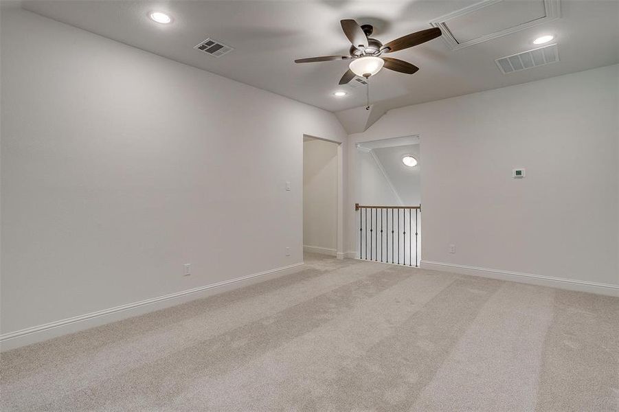 Unfurnished room with carpet floors and ceiling fan