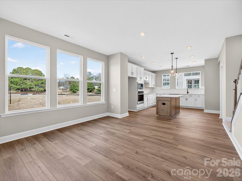 Dining Space with Wall of Windows and Filled with Light.