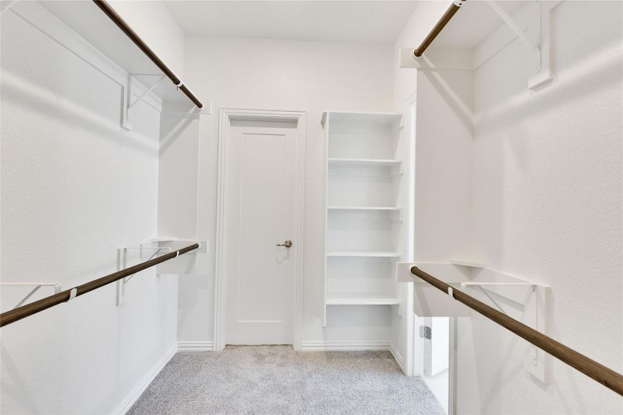 Walk in closet with light carpet Walk in closet with light carpet