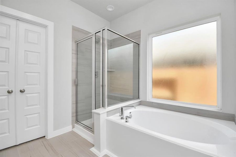 Another view of the primary bath. Photo shown is example of completed home with similar plan. Actual colors and selections may vary.