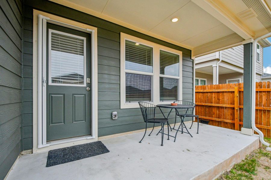 Property entrance featuring a patio area