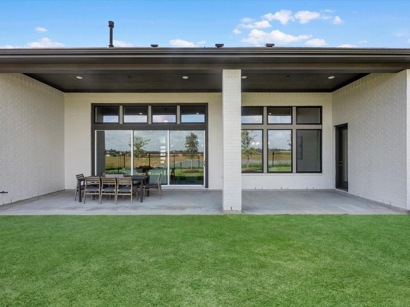 Exterior details and patio area of a home in Dunham Pointe, Cypress (Image 3).