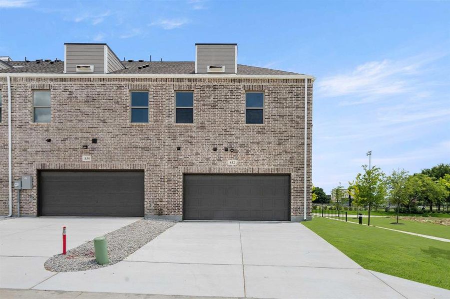 Front exterior of a new home in Parkside, Mansfield, TX, highlighting curb appeal (Image 22). Front exterior of a new home in Parkside, Mansfield, TX, highlighting curb appeal (Image 22).