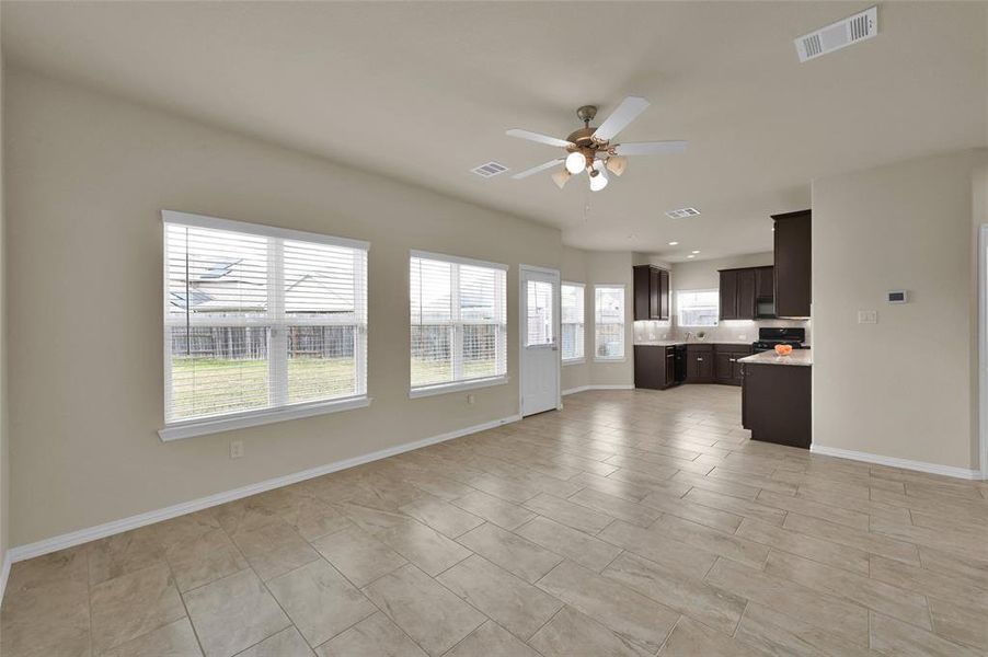 Grand room open to Kitchen (view from bottom of stairs)