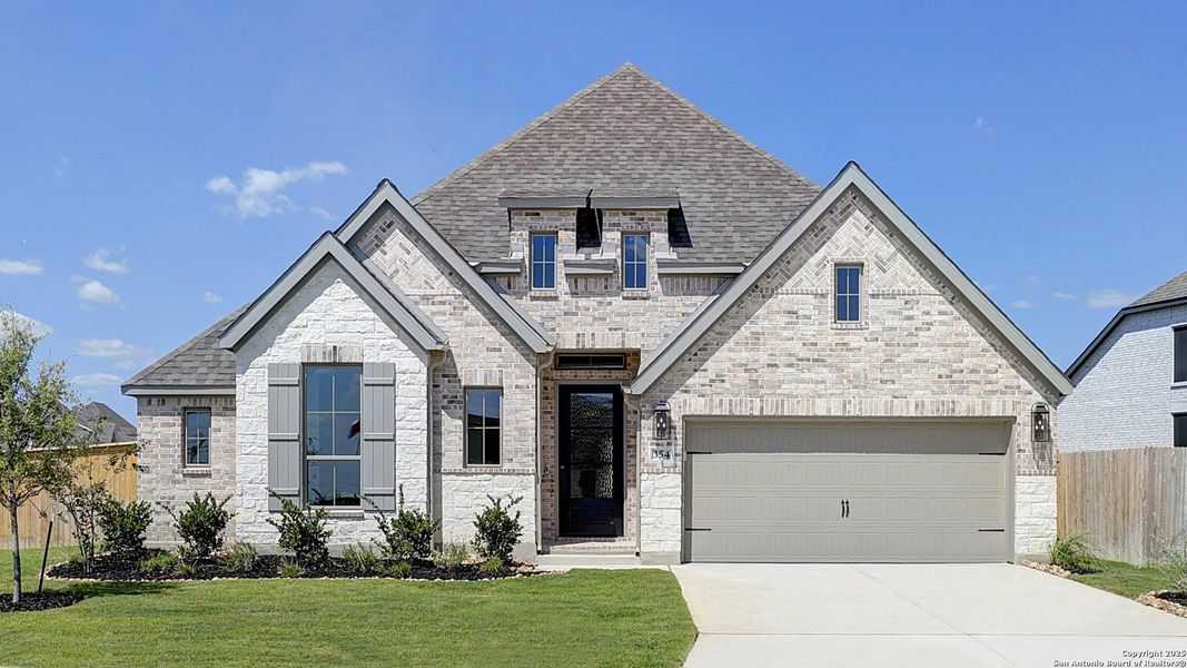 Front exterior of a new home in Alsatian Oaks 60', Castroville, TX, highlighting curb appeal (Image 19). Front exterior of a new home in Alsatian Oaks 60', Castroville, TX, highlighting curb appeal (Image 19).
