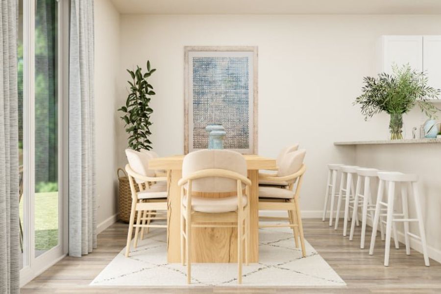 A dining room table with chairs.