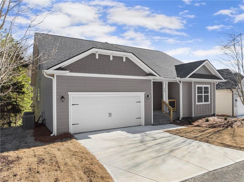 Front exterior of a new home in Chambers Landing, Commerce, GA, highlighting curb appeal (Image 22). Front exterior of a new home in Chambers Landing, Commerce, GA, highlighting curb appeal (Image 22).
