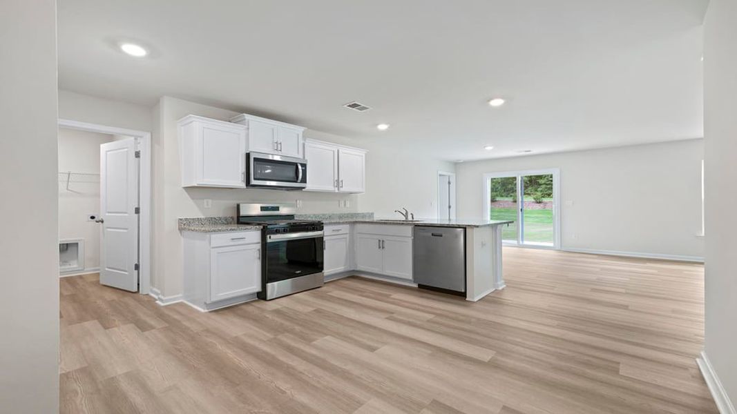 Furnished interior view inside a new home in Bentley Park, Greenwood (Image 5).