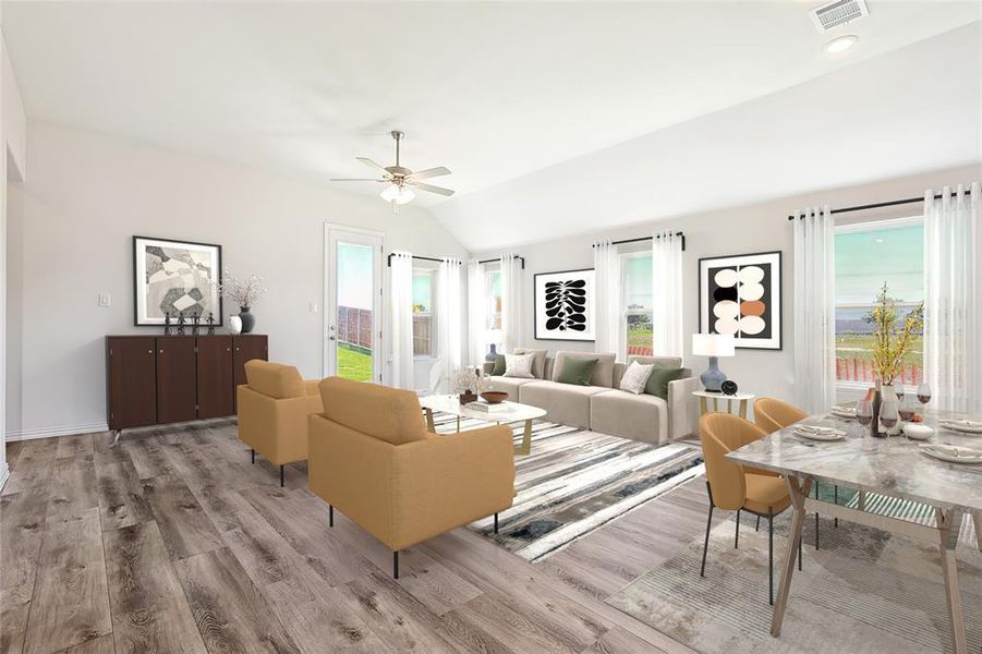 Living room featuring light hardwood / wood-style flooring, lofted ceiling, and ceiling fan