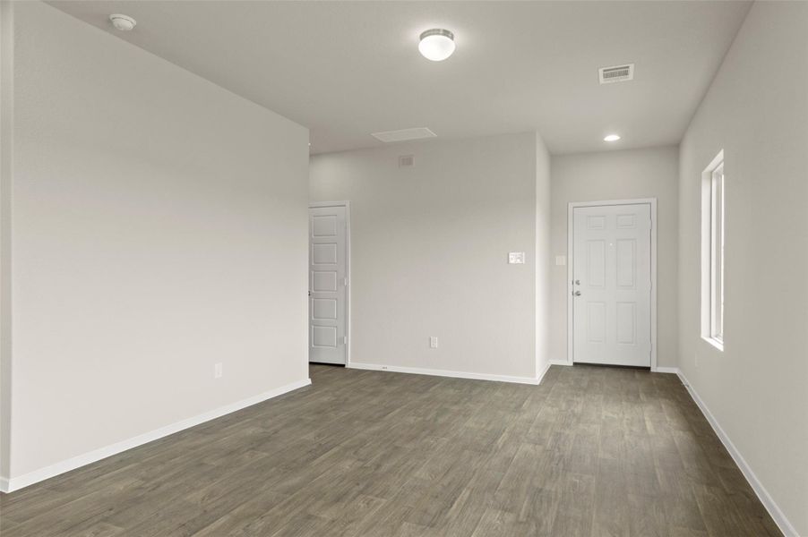 Unfurnished room with dark wood-style floors and recessed lighting