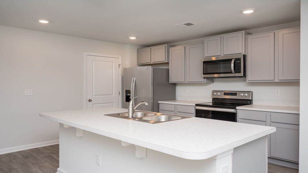 Representative furnished interior of a home built from the ARIA by D.R. Horton in The Meadows at Wildwood Village, Shallotte (Image 8). Representative furnished interior of a home built from the ARIA by D.R. Horton in The Meadows at Wildwood Village, Shallotte (Image 8).
