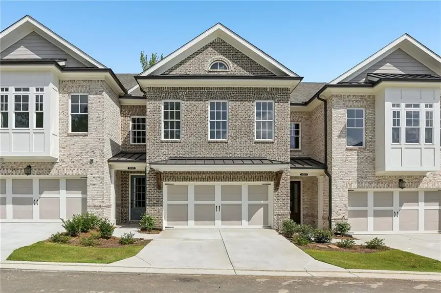 Front exterior of a new home in Waterside, Peachtree Corners, GA, highlighting curb appeal (Image 2). Front exterior of a new home in Waterside, Peachtree Corners, GA, highlighting curb appeal (Image 2).