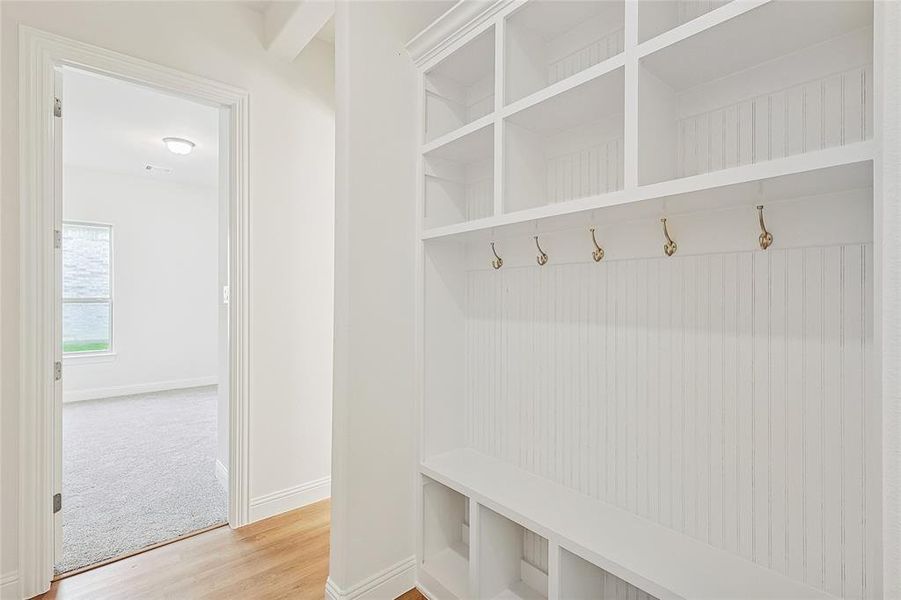 Mudroom with light wood-type flooring and baseboards Mudroom with light wood-type flooring and baseboards