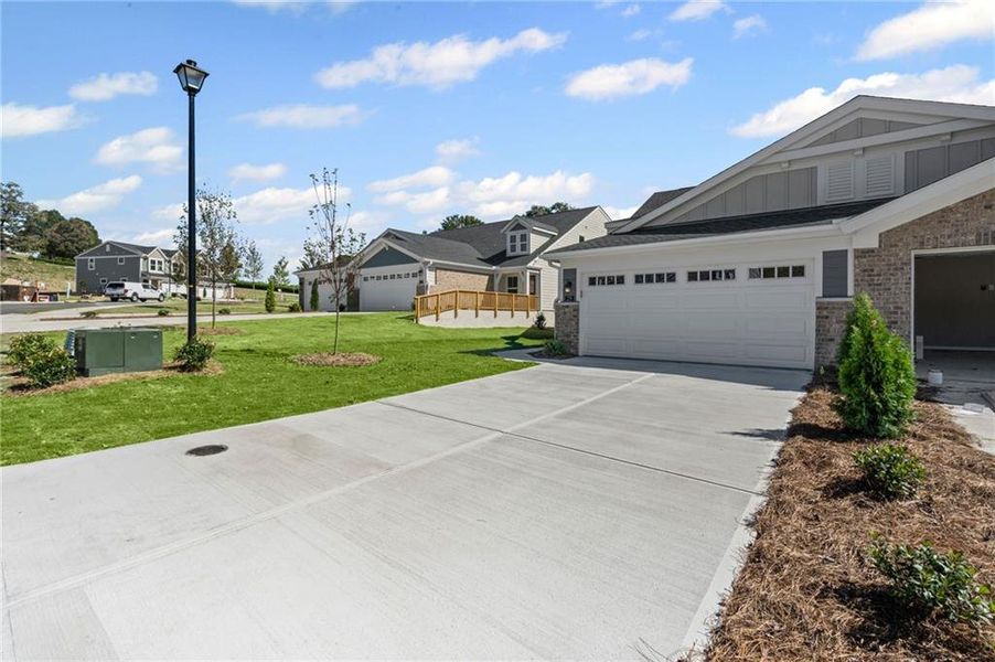 Front exterior of a new home in Villas at Gold Creek, Dawsonville, GA, highlighting curb appeal (Image 19). Front exterior of a new home in Villas at Gold Creek, Dawsonville, GA, highlighting curb appeal (Image 19).