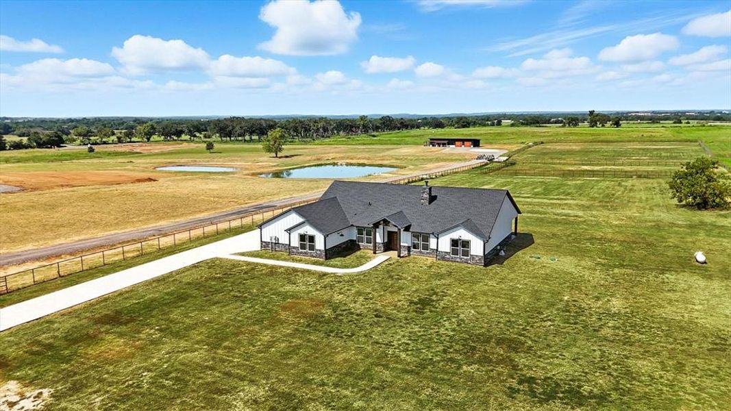 Front exterior of a new home in , Whitesboro, TX, highlighting curb appeal (Image 22). Front exterior of a new home in , Whitesboro, TX, highlighting curb appeal (Image 22).