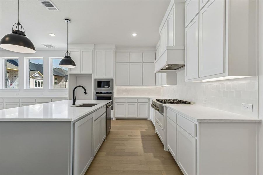 All the chef's in the family will love working together in this spacious kitchen featuring ample storage and prep space!