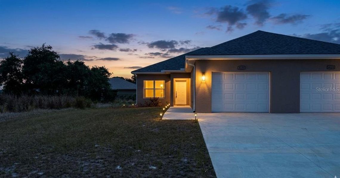 Front exterior of a new home in , Sebring, FL, highlighting curb appeal (Image 1). Front exterior of a new home in , Sebring, FL, highlighting curb appeal (Image 1).