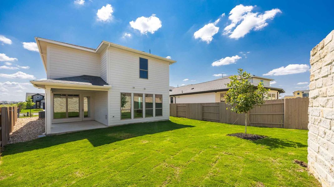 Rear view of property with a patio and a fenced backyard Rear view of property with a patio and a fenced backyard