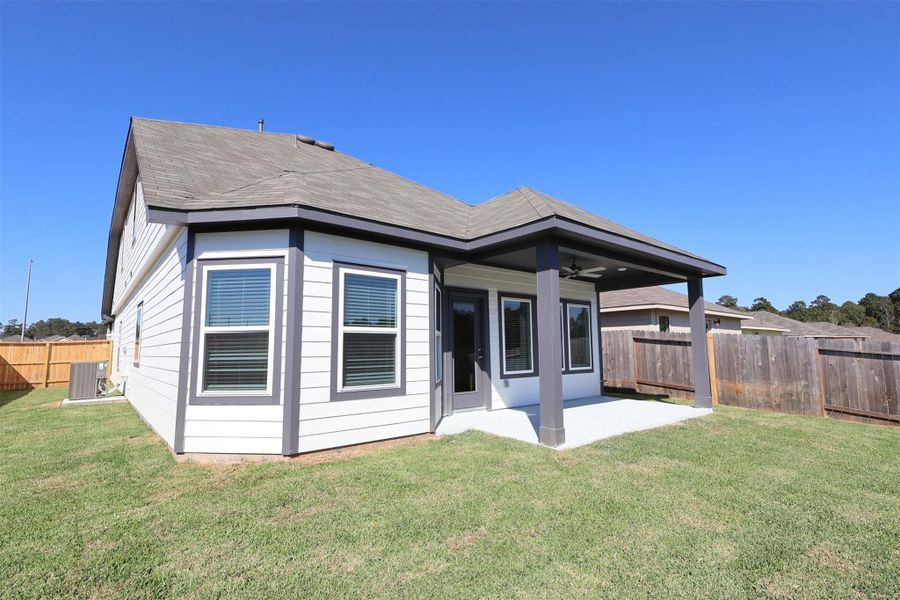 Exterior details and patio area of a home in Magnolia Ridge, Magnolia (Image 4). Exterior details and patio area of a home in Magnolia Ridge, Magnolia (Image 4).