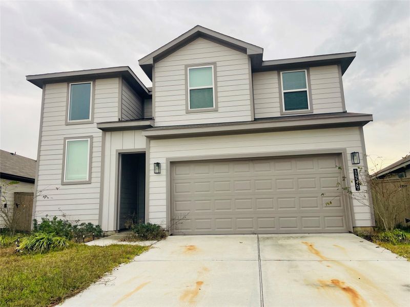 Front exterior of a new home in Presswoods, Splendora, TX, highlighting curb appeal (Image 11).