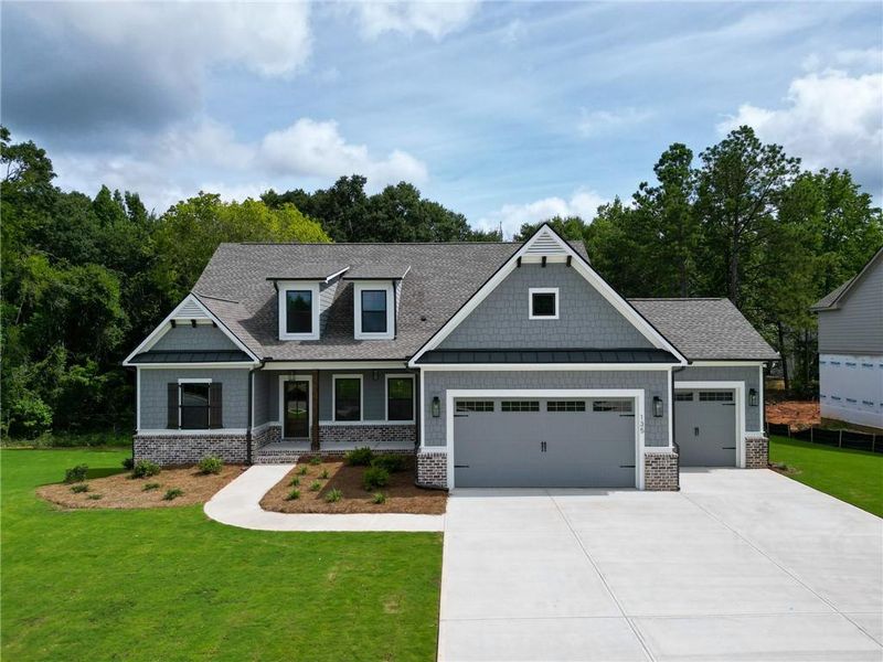 Front exterior of a new home in Riverwalk, Monroe, GA, highlighting curb appeal (Image 2). Front exterior of a new home in Riverwalk, Monroe, GA, highlighting curb appeal (Image 2).