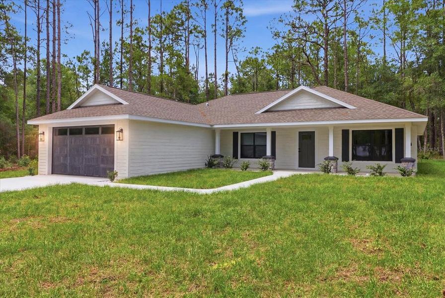 Front exterior of a new home in , Hernando, FL, highlighting curb appeal (Image 2). Front exterior of a new home in , Hernando, FL, highlighting curb appeal (Image 2).