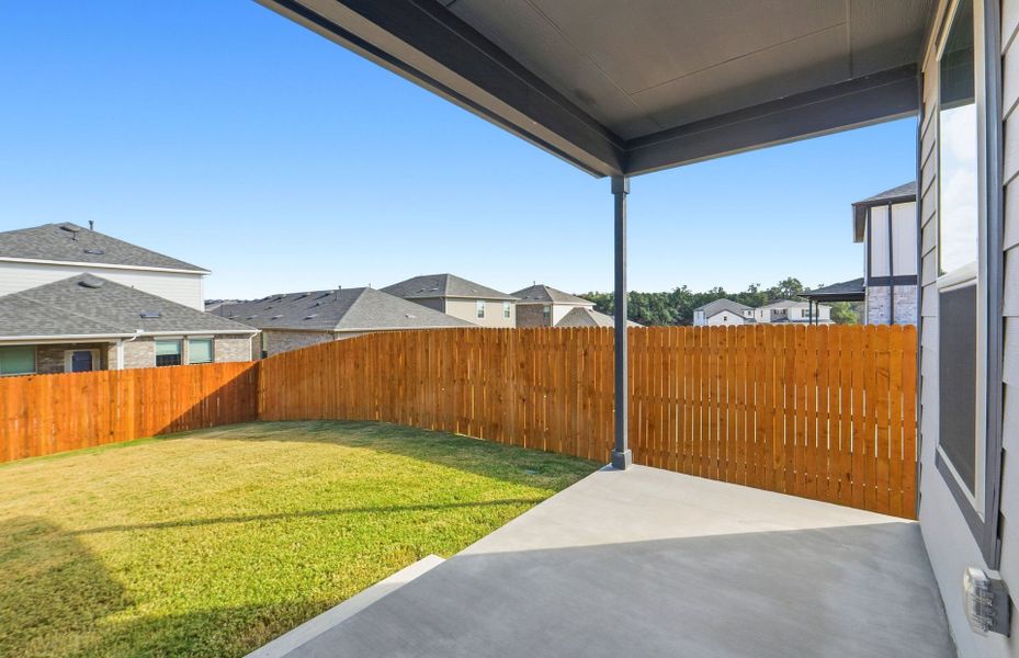 Exterior details and patio area of a home in Saddleback at Santa Rita Ranch, Liberty Hill (Image 24).