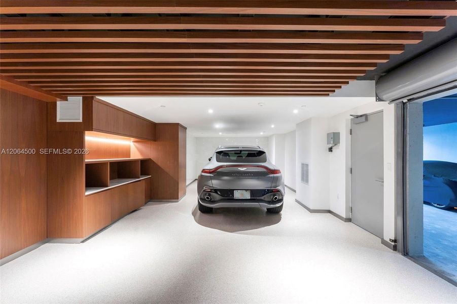 Private air-conditioned garage accommodating 2 cars, plus 3 additional side-by-side parking spaces included with the unit. Private air-conditioned garage accommodating 2 cars, plus 3 additional side-by-side parking spaces included with the unit.