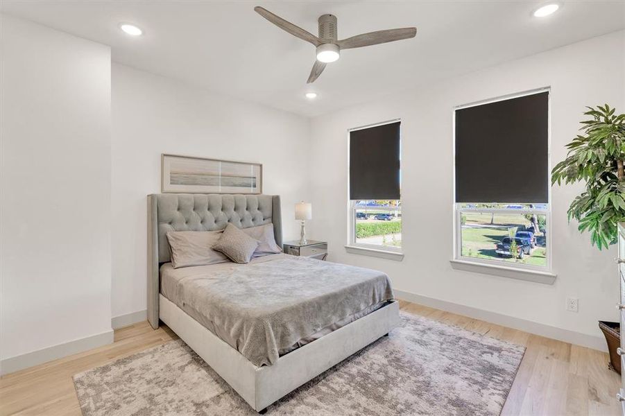 Bedroom featuring ceiling fan and light wood-type flooring