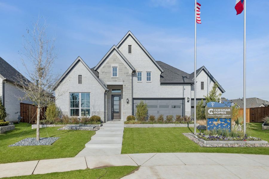 Front exterior of a new home in Trinity Falls, McKinney, TX, highlighting curb appeal (Image 16).