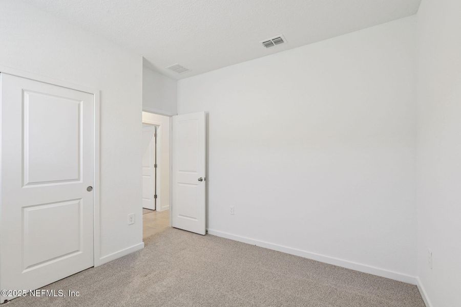 Spacious, unfurnished interior of a new home in Lakes at Bella Lago - Signature Series, Green Cove Springs (Image 24). Spacious, unfurnished interior of a new home in Lakes at Bella Lago - Signature Series, Green Cove Springs (Image 24).