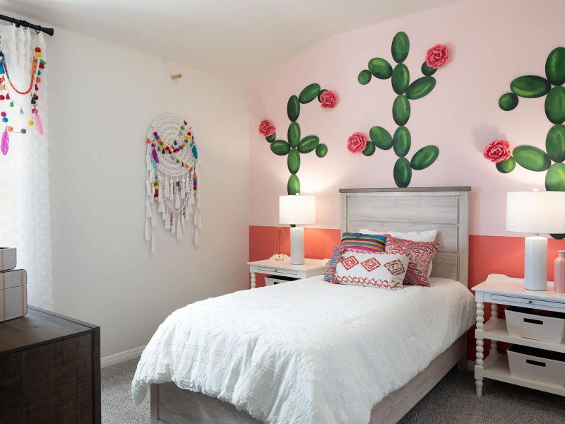 Carpeted bedroom featuring baseboards