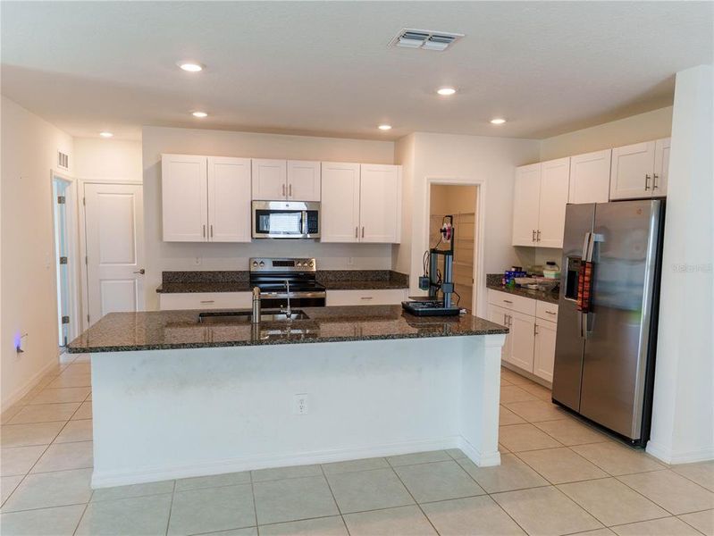 Furnished interior view inside a new home in The Isle of Avalon, Spring Hill (Image 5).