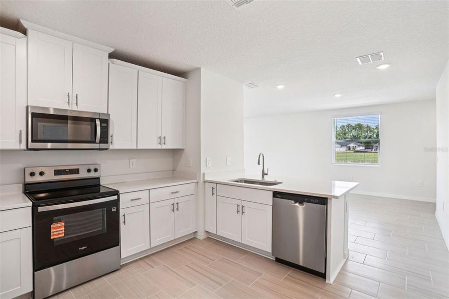 Furnished interior view inside a new home in Ridgehaven - Villas, Ormond Beach (Image 9).