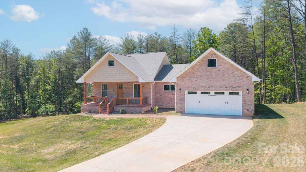 Front exterior of a new home in , Morganton, NC, highlighting curb appeal (Image 2).