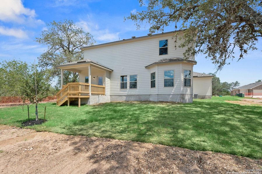 Front exterior of a new home in Jordan's Ranch, San Antonio, TX, highlighting curb appeal (Image 2). Front exterior of a new home in Jordan's Ranch, San Antonio, TX, highlighting curb appeal (Image 2).