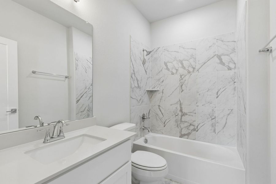 Bathroom in the Winters home plan by Trophy Signature Homes – REPRESENTATIVE PHOTO