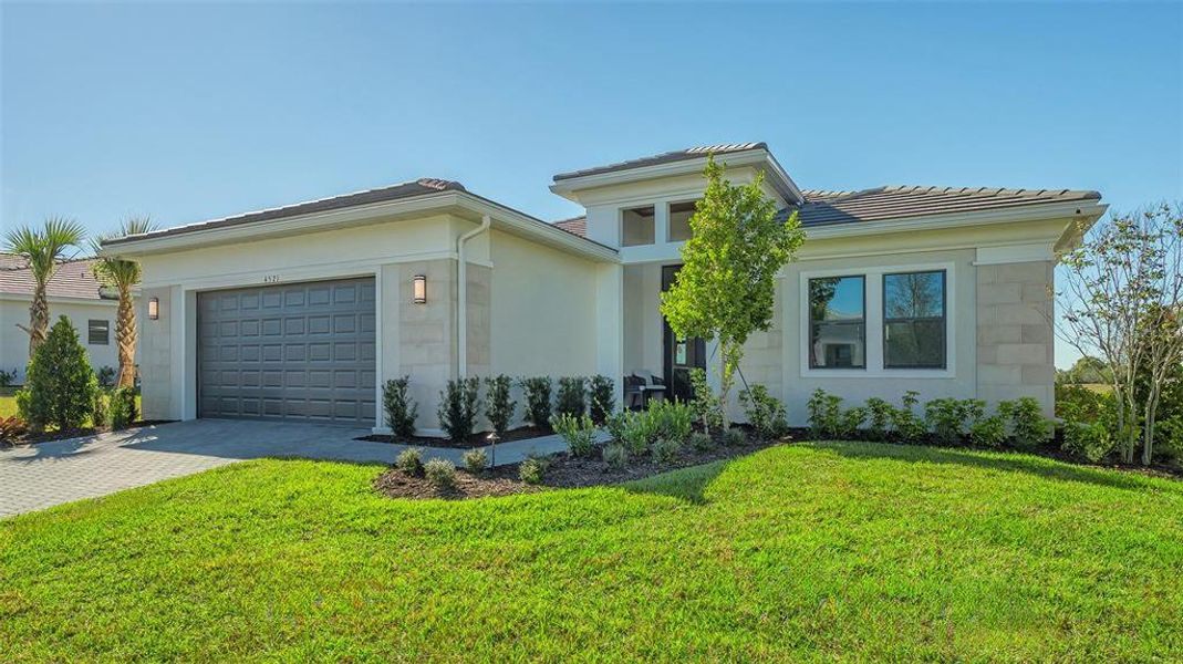 Front exterior of a new home in , Sarasota, FL, highlighting curb appeal (Image 28).