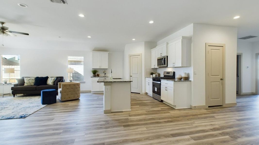 Representative furnished interior of a home built from the The Lakeway by D.R. Horton in Abbey Glen, Lubbock (Image 7).