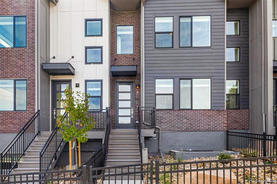 Front exterior of a new home in Ascent at Inverness, Englewood, CO, highlighting curb appeal (Image 20).