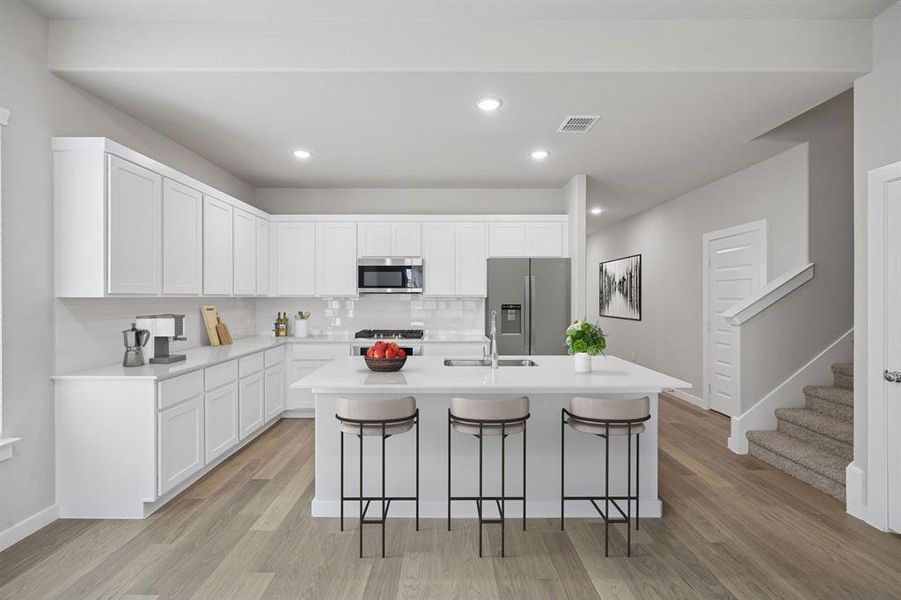 Kitchen in the Stanley II home plan by Trophy Signature Homes – REPRESENTATIVE PHOTO