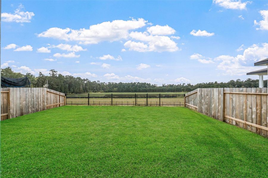 Exterior details and patio area of a home in Lakes at Black Oak, Magnolia (Image 12). Exterior details and patio area of a home in Lakes at Black Oak, Magnolia (Image 12).