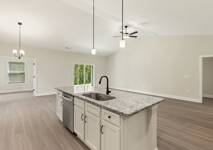 The kitchen looks over the living area